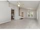 Spacious living room with plush carpeting and French doors leading to the exterior at 3235 Grand Pines Dr, Lakeland, FL 33810