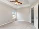 Large main bedroom with neutral color palette, plush carpet, and a ceiling fan at 3235 Grand Pines Dr, Lakeland, FL 33810