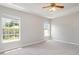 Spacious main bedroom offering ample natural light through large windows at 3235 Grand Pines Dr, Lakeland, FL 33810