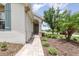 Inviting front entrance with a quaint, brick-paved walkway leading to the home's welcoming door at 3321 Pintello Ave, New Smyrna Beach, FL 32168