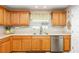 Kitchen showcasing a stainless steel sink, modern fixtures, and stylish window treatment at 3321 Pintello Ave, New Smyrna Beach, FL 32168