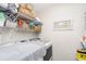 Laundry room featuring washer, dryer, wire shelving, and built-in storage at 3321 Pintello Ave, New Smyrna Beach, FL 32168