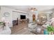 Open-concept layout showcasing a comfortable living area with wood floors and seamless flow to other rooms at 3321 Pintello Ave, New Smyrna Beach, FL 32168