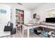 Home office features a closet, desk, shelving unit, and wood laminate flooring at 3321 Pintello Ave, New Smyrna Beach, FL 32168