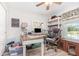 Inviting home office with wood floors, ceiling fan, desk, shelving and natural light at 3321 Pintello Ave, New Smyrna Beach, FL 32168