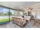 A covered patio provides comfortable seating, screened windows, and views of the manicured lawn at 3321 Pintello Ave, New Smyrna Beach, FL 32168