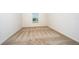 Cozy bedroom featuring plush carpet, a window with blinds, and neutral-toned walls at 781 Poppy Ln, Dundee, FL 33838