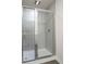 Modern bathroom featuring new tiled shower with glass doors at 781 Poppy Ln, Dundee, FL 33838