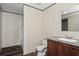 Bathroom features a sink with vanity, toilet, and stand-up shower with a curtain at 40144 Camphor Rd, Lady Lake, FL 32159