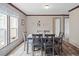 Dining room with gray table, natural light and stone accent wall at 40144 Camphor Rd, Lady Lake, FL 32159