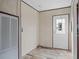 Laundry room with neutral color paint and wood look floors at 40144 Camphor Rd, Lady Lake, FL 32159