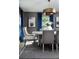 Beautiful dining room features a round table, modern chandelier and stylish decor at 6200 Sw 97Th St, Ocala, FL 34476
