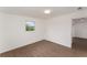 Bright bedroom with new flooring, crisp white walls, and natural light at 833 N Suwannee Ave, Lakeland, FL 33815