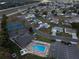 Community aerial view with a pool, tennis courts, recreation center and easy access to the highway at 1074 Canary S Cir, Lakeland, FL 33809