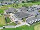 An aerial view showing the clubhouse, golf course, and surrounding neighborhood at 1074 Canary S Cir, Lakeland, FL 33809