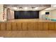 Auditorium stage with wooden floors and cabinets, curtains, and stage lighting at 1074 Canary S Cir, Lakeland, FL 33809