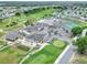 Aerial view of community center, golf course, pool, and tennis courts at 1074 Canary S Cir, Lakeland, FL 33809