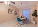 Bright dining area showcases a modern round table with colorful chairs and contemporary art at 1074 Canary S Cir, Lakeland, FL 33809
