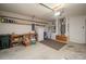 Spacious garage with shelving and includes a workbench, refrigerator, washer, and dryer at 1074 Canary S Cir, Lakeland, FL 33809