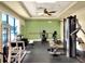 Well-equipped gym with various exercise machines, weights, and ample workout space at 1074 Canary S Cir, Lakeland, FL 33809