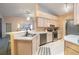 Well-equipped kitchen features stainless steel appliances, white cabinets, and breakfast bar with seating at 1074 Canary S Cir, Lakeland, FL 33809