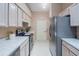 Bright kitchen features modern appliances, ample counter space, and convenient access to garage door at 1074 Canary S Cir, Lakeland, FL 33809