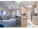 Open-concept living and dining area featuring tile floors and seamless access to kitchen at 1074 Canary S Cir, Lakeland, FL 33809