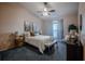 A serene main bedroom featuring a vaulted ceiling, soft natural light, and soothing color tones at 1074 Canary S Cir, Lakeland, FL 33809