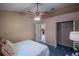 Bright main bedroom features plush carpet, neutral decor, ceiling fan, and closet at 1074 Canary S Cir, Lakeland, FL 33809