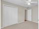 Bedroom featuring plush carpet, bright ceiling fan, and closet for storage at 879 Astor Way, The Villages, FL 32162