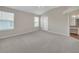 Spacious bedroom with neutral walls, carpet and plenty of natural light at 879 Astor Way, The Villages, FL 32162