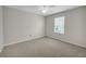 Cozy bedroom with neutral walls, carpet and a bright window with natural light at 879 Astor Way, The Villages, FL 32162