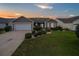 Beautiful single Gathering home with lush lawn and inviting front entrance at 879 Astor Way, The Villages, FL 32162