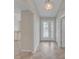 Inviting home foyer features tile flooring, neutral walls, and a decorative glass front door at 879 Astor Way, The Villages, FL 32162