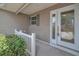 Charming front entrance with decorative glass door and well-maintained landscaping at 879 Astor Way, The Villages, FL 32162