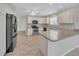 Spacious kitchen with a tile floor, breakfast bar, and white cabinets at 879 Astor Way, The Villages, FL 32162