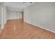 Large living room with laminate wood flooring and a ceiling fan at 879 Astor Way, The Villages, FL 32162