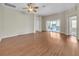 Open-concept living room with vaulted ceilings and sliding glass doors to the patio at 879 Astor Way, The Villages, FL 32162