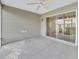 Inviting screened-in patio with concrete flooring and view to the backyard, offering space to relax at 879 Astor Way, The Villages, FL 32162