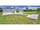 Lush backyard featuring a concrete patio perfect for outdoor entertaining and serene relaxation at 359 Terminal Ave, Polk City, FL 33868