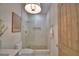 Modern bathroom showcasing a glass shower, earth-toned fixtures, and minimalist design elements at 359 Terminal Ave, Polk City, FL 33868