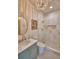 Charming bathroom featuring a marble vanity, shower with glass, modern fixtures, and decorative accents at 359 Terminal Ave, Polk City, FL 33868