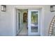 View from bedroom entrance with an ensuite bathroom and backyard view, showcasing indoor-outdoor living at 359 Terminal Ave, Polk City, FL 33868