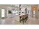 Bright kitchen with stainless steel appliances, marble countertops, large island, and ample storage at 359 Terminal Ave, Polk City, FL 33868