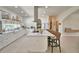Elegant kitchen with stainless steel appliances, island with bar stool seating, and marble countertops at 359 Terminal Ave, Polk City, FL 33868