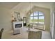 Inviting living room with a fireplace, comfortable seating, and a large window overlooking the outdoors at 359 Terminal Ave, Polk City, FL 33868