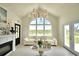 Bright living room with a fireplace, comfortable seating, and a large window overlooking the outdoors at 359 Terminal Ave, Polk City, FL 33868