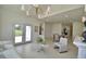 Bright living room featuring neutral walls, light tile flooring, and elegant furnishings at 359 Terminal Ave, Polk City, FL 33868