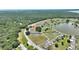 An elevated view of the property showing proximity to the lake and lush scenery at 4709 Club Cir, Lakeshore, FL 33854