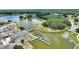 Overhead view of community amenities, showcasing waterways, boat docks, and community building at 4709 Club Cir, Lakeshore, FL 33854